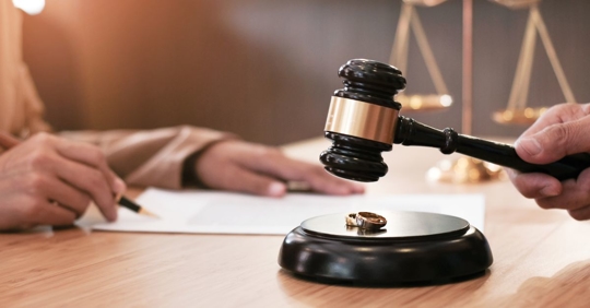 signing a contract next to a gavel